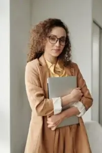 a woman holding a laptop